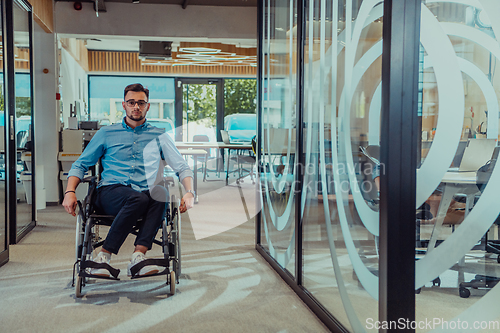 Image of In a large modern corporation, a determined businessman in a wheelchair navigates through a hallway, embodying empowerment and inclusivity in the corporate world.