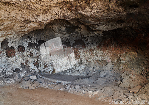 Image of Abandoned old cave and secret underground tunnel formed from molten lava and igneous rock after a volcanic eruption in Los Llanos, La Palma, Spain. Ancient ruins with hidden stone chamber and cavern