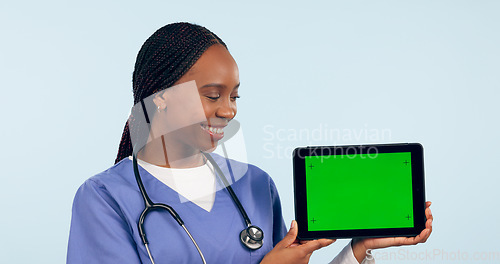 Image of Green screen, doctor and woman with tablet for telehealth, clinic promotion and medical news. Healthcare, mockup and person on digital technology for website, research and online consulting in studio