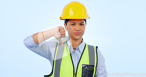 Image of Woman, thumbs down and engineer for construction by architect in studio by blue background. Asian female, development and negative review for real estate fail, inspection and dislike in mockup
