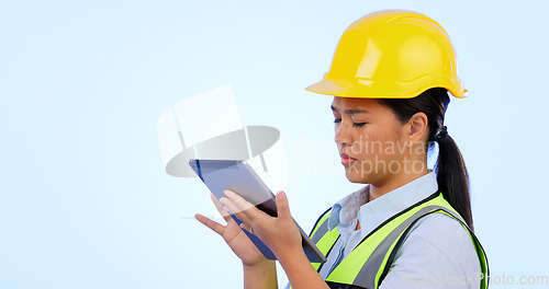 Image of Woman, engineer and maintenance with tablet for construction, safety and studio by blue background. Asian female, architecture and development or real estate, tech and project management in mockup