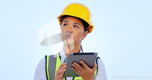 Image of Engineer, woman and thinking with tablet for construction, project management and studio by blue background. Asian female, architecture and development or real estate, planning and safety in mockup