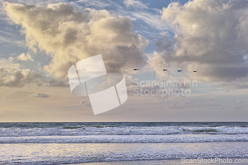 Image of Seascape and landscape of a blue sunset on the west coast of Jutland in Loekken, Denmark. Beautiful cloudscape on an empty beach at dusk. Clouds over the ocean and sea at night with copyspace