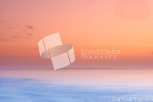 Image of Seascape and landscape of a golden sunset on the west coast of Jutland in Loekken, Denmark. Beautiful cloudscape on an empty beach at dusk. Clouds over the ocean and sea in the evening with copyspace