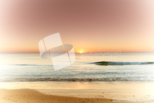 Image of Seascape and landscape of a golden sunset on the west coast of Jutland in Loekken, Denmark. Beautiful cloudscape on an empty beach at dusk. Clouds over the ocean and sea in the evening with copyspace