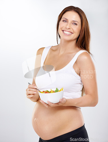 Image of Portrait, salad and pregnant with woman, nutrition and smile on a studio white background. Person, bowl and model with happiness, girl and pregnancy with vegetables, vitamins and maternal with meal