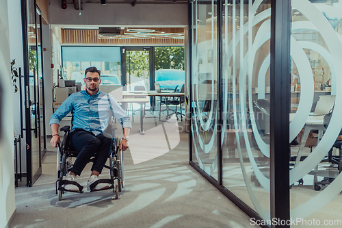 Image of In a large modern corporation, a determined businessman in a wheelchair navigates through a hallway, embodying empowerment and inclusivity in the corporate world.