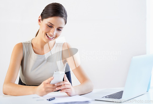 Image of Business woman, paperwork or planning on a phone for reading data, news and documents for report. Smile, laptop and happy worker in office on website typing to research on social media blog on break