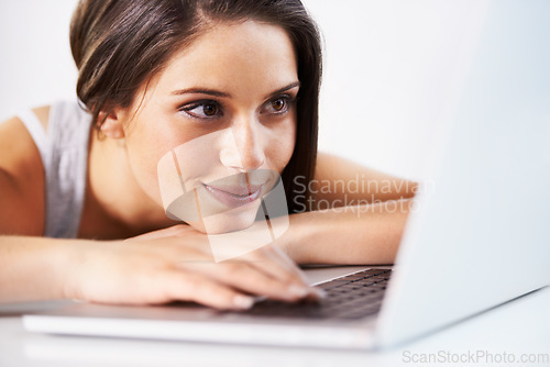 Image of Laptop, relax or woman in office typing, writing email or web surfing for research analysis on internet. Business, computer and happy female worker working on pc planning at work in company or agency