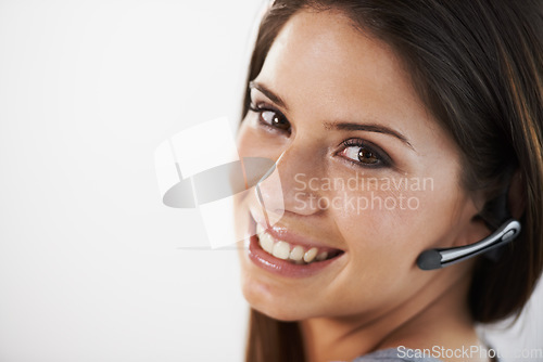Image of Woman, call center and telemarketing portrait for e commerce sales, communication and chat on a white background. Face of a young consultant or telecom agent with headphone for contact us in studio