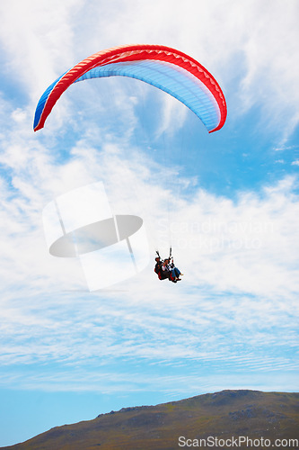 Image of People, paragliding and freedom in sky, mountain or extreme sport with smile for fitness. Coach, partnership and person on adventure, clouds or fearless with backpack, parachute or flight in summer