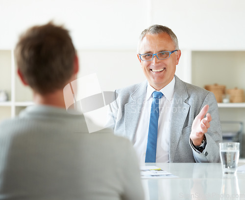 Image of Meeting, people and happy mature lawyer with advice in office for legal consulting and feedback for client, Businessman, talking and professional attorney in law firm with discussion of contract