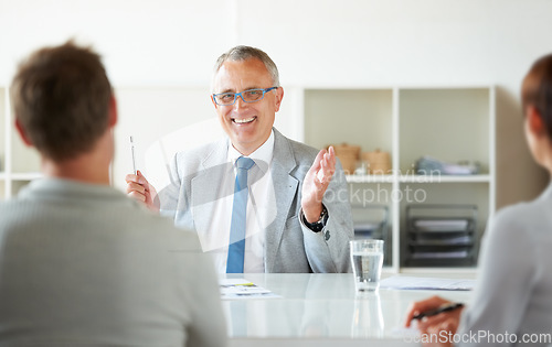 Image of People, meeting and mature lawyer with advice in office for legal consulting and feedback for clients, Happy, businessman and expert attorney speaking of success as professional advocate in law firm