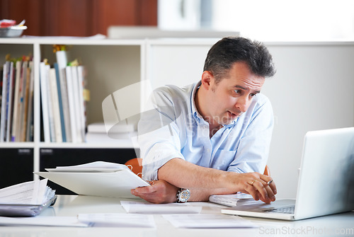 Image of Business man, laptop and documents with reading, scroll and thinking with finance review, budget or audit. Accountant, computer and paperwork for financial compliance in office, process and solution
