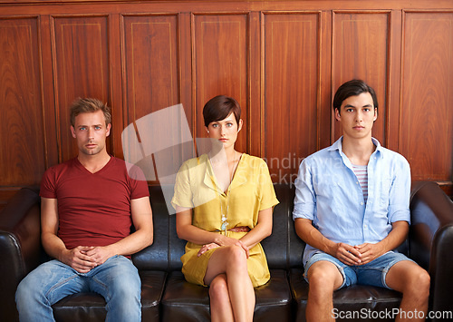 Image of Portrait, recruitment and bored people waiting on a sofa in an office for a human resources interview. Business, hiring and job opportunity with an impatient candidate group in a workplace lobby