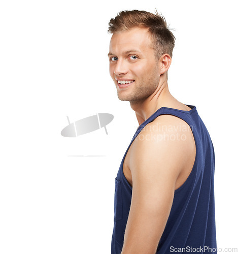 Image of Portrait, smile and fashion with a man in studio isolated on a white background to wear a tank top. Relax, casual and a happy young model in a trendy or comfortable clothes outfit with mockup space