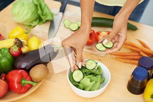 Image of Hands, salad and a person cooking from above in the kitchen of a home for health, diet or nutrition. Food, recipe and ingredients in a bowl with an adult in an apartment for a vegetarian meal closeup
