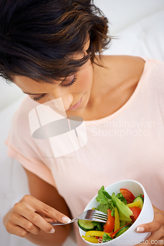 Image of Food, health and young woman with a salad at home with vegetables for wellness, organic or diet. Top view, nutrition and female person from Mexico eating healthy meal with produce in living room.