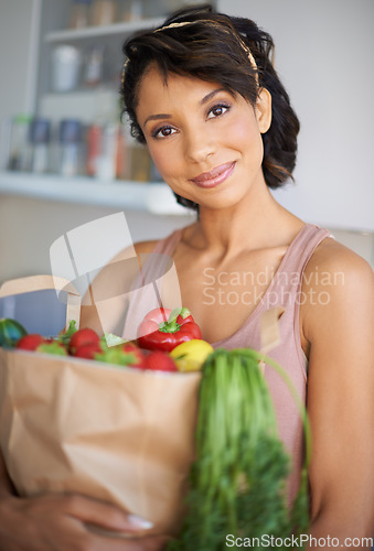 Image of Happy woman, portrait and grocery bag with vegetables or fresh produce in kitchen at home. Female person, shopper or vegan smile with food or groceries for salad, cooking or healthy diet at house