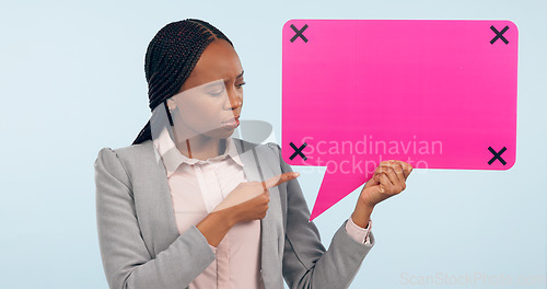 Image of Speech bubble, mockup and review with a business black woman pointing in studio on a gray background. Space, information or announcement and a young employee holding a sign with tracking markers