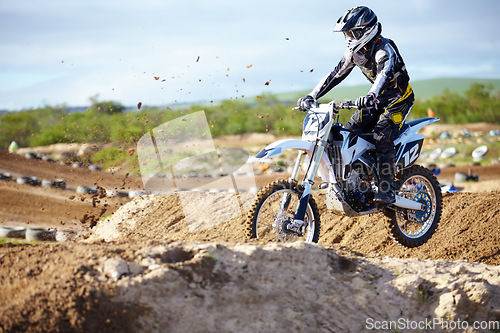 Image of Man, motorcycle or off road race track jump as professional person in action danger, competition or fearless. Bike rider, transportation or fast speed adventure or rally, extreme sport or challenge