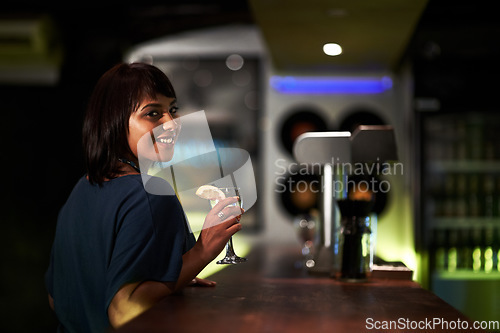Image of Woman, smile and drink in portrait at bar, face and happy at event, party or social gathering. Female person, alcohol and cocktail for fun, relax and travel to Ibiza, dark and joy at night on face