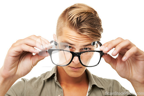Image of Perspective, portrait and a man with glasses on a white background for vision, eye care or test. Fashion, face and a person showing eyewear for lens, frame or optometry exam on a studio backdrop