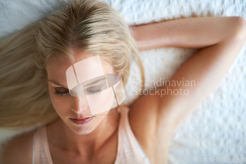 Image of Woman, eyes closed and face for beauty, makeup or cosmetic in bedroom in Norway by above. Person, relax or calm for satisfaction in result, pigment or application of eyeshadow, lipstick or foundation