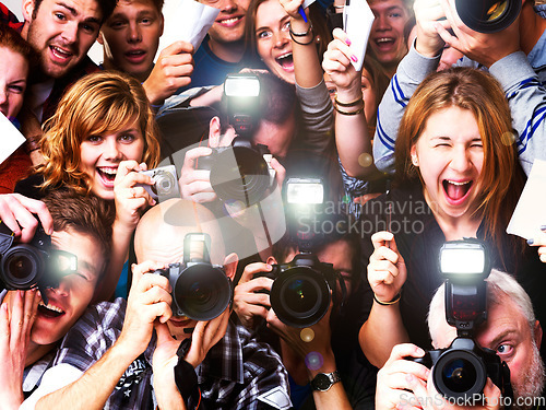 Image of Mass hysteria. A group of paparazzi and fans going hysterical - - This is a highly retouched image and may not be a good option for a large poster project.