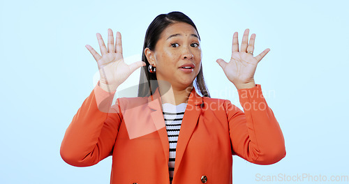 Image of Portrait, warning and woman with stop, rejection and reaction on a blue studio background. Face, person and model with hand gesture, body language and deny with mockup space, feedback and review