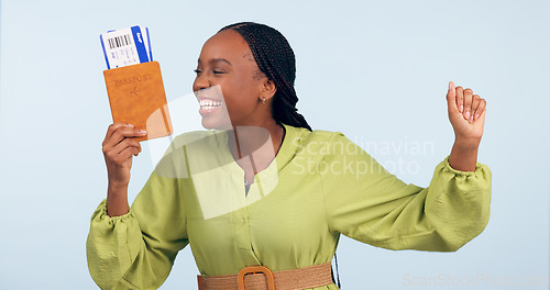 Image of African woman, passport and studio with fist celebration for airplane ticket, document or excited by blue background. Girl, legal paperwork and win for compliance, immigration or international travel