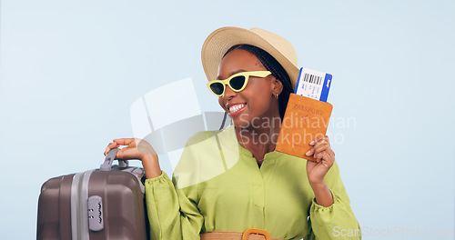 Image of Happy African woman, passport and studio with suitcase, airplane ticket and documents by blue background. Girl, legal paperwork and luggage for compliance, vacation and sunglasses for global travel