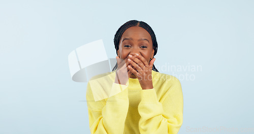 Image of Covering mouth, wow and portrait of a black woman with a secret, gossip or rumor on a blue background. Shock, happiness and excited African girl with expression of surprise, amazed and good news