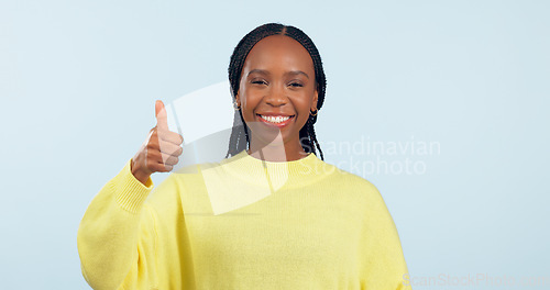 Image of Portrait, opportunity and black woman with thumbs up, support and decision on a blue studio background. Face, African person and model with hand gesture, sign and feedback with review and emoji