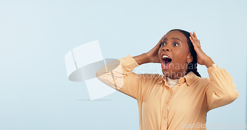 Image of Wow, space and surprise with a black woman in studio on a gray background to hear good news. Emoji, mock up and expression with a mind blown young person looking shocked by a promotion or bonus