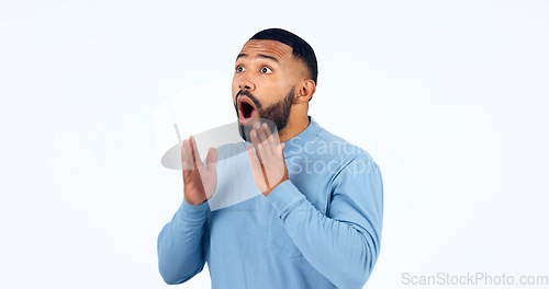 Image of News, announcement and man with surprise on face in studio, white background or mockup space. Wow, emoji and excited or shocked person with secret, drama or hearing crazy information on promotion