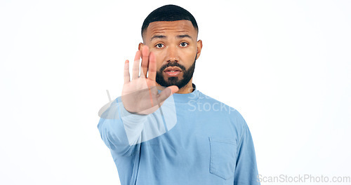 Image of Stop, hand and portrait of man in studio with limits, control or warning order on white background. Protest, palm and face of male model with emoji vote, dont or no, rejection or not allowed sign