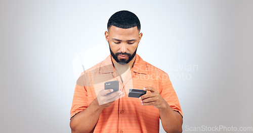 Image of Man, smartphone and credit card in studio for online shopping, fintech payment and digital account on white background. Mobile banking, password and code for ecommerce app, sales or financial savings