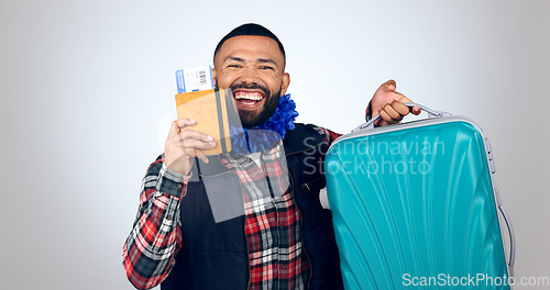 Image of Happy man, suitcase and plane ticket for travel, excited about trip in portrait isolated on white background. Luggage, holiday and booking paperwork with passport and ready for adventure in studio