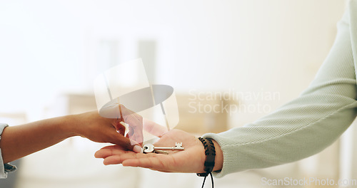 Image of Hands, moving and key by handing over in new home by realtor to owner in sale of property. Closeup, woman and customer for mortgage loan, purchase agreement or investment in real estate by contract