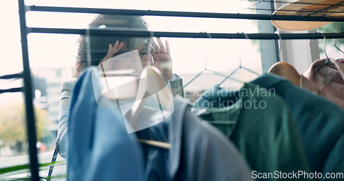 Image of Window, shopping and woman with fashion, sale or outfit search at a thrift store or boutique. Glass, hands and female customer looking in to mall, display or retail, deal and market, offer or choice