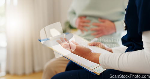 Image of People hands, clipboard or nurse consultation on stomach pain, gastric cancer or check abdomen problem, anatomy or assessment. Consultation, patient and closeup caregiver with healthcare survey notes