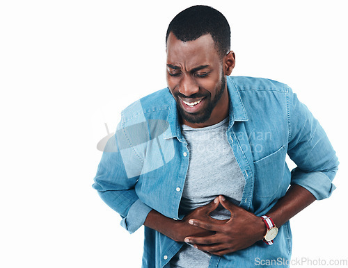 Image of Sick, black man and stomach pain from food poisoning, virus or ibs gas in studio or white background. Medical, problem and digestion ache in colon with health emergency or diarrhea in mockup space