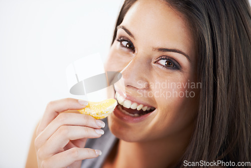 Image of Healthy, diet and portrait of woman with orange in studio for detox, care or gut health promo on white background. Face, smile and model with fruit for weight loss, wellness or vitamin c nutrition