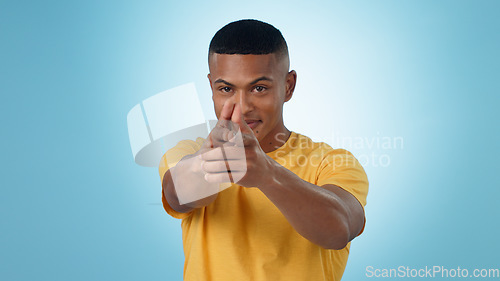 Image of Portrait, finger gun and man aim at target in studio isolated on a blue background mockup space. Face, shooting hand gesture or African person pointing pistol weapon for self defence to kill criminal