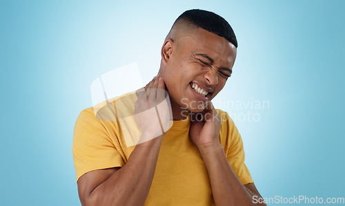 Image of Neck pain, stress and man in studio with burnout, musical or joint crisis on blue background. Shoulder, injury and face of male model with anxiety for arthritis, fibromyalgia or osteoporosis tension