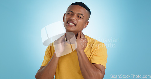 Image of Stress, neck pain and man in studio with burnout, muscle or joint crisis on blue background. Shoulder, injury and face of male model with anxiety for arthritis, fibromyalgia or osteoporosis tension