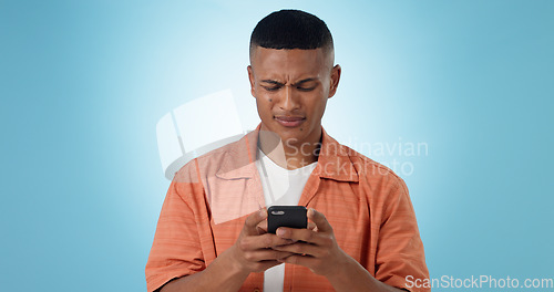 Image of Doubt, confused and man with cellphone, typing and connection with digital app on blue background. Person, guy and model with smartphone, mobile user or reaction with expression, error 404 or contact