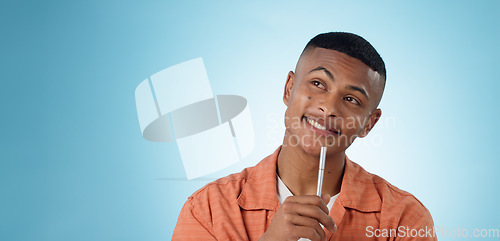 Image of Thinking, pen and man in studio with idea, solution or problem solving on blue background space. Questions, face or male university student with brainstorming emoji for solution, answer or conclusion