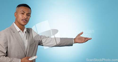 Image of Weather forecast, portrait or man talking with hands for mockup space on blue background. Reporter, anchor or presenter in broadcast for presentation, climate change prediction or news in studio